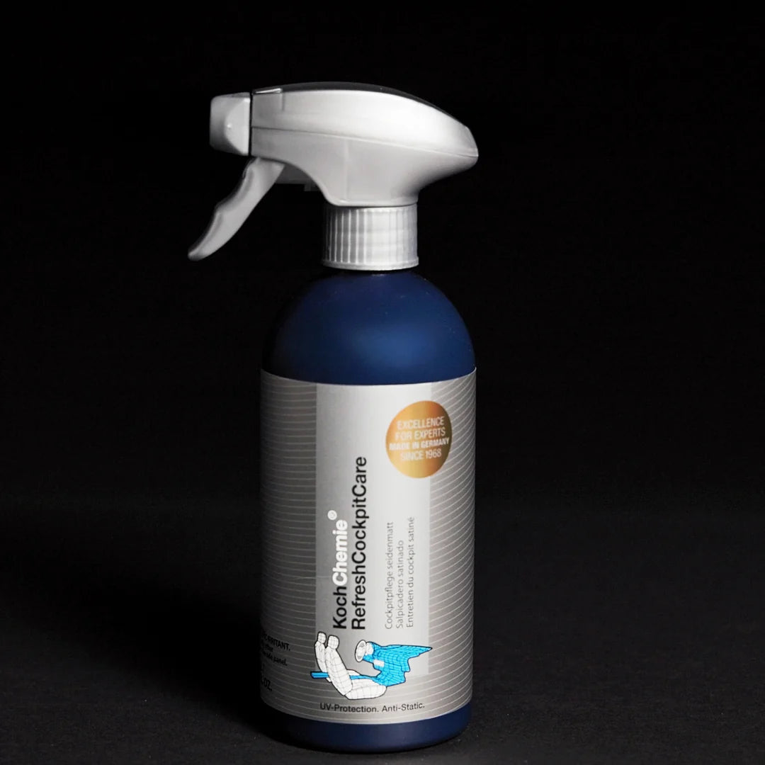 Blue spray bottle with a white label on a black background